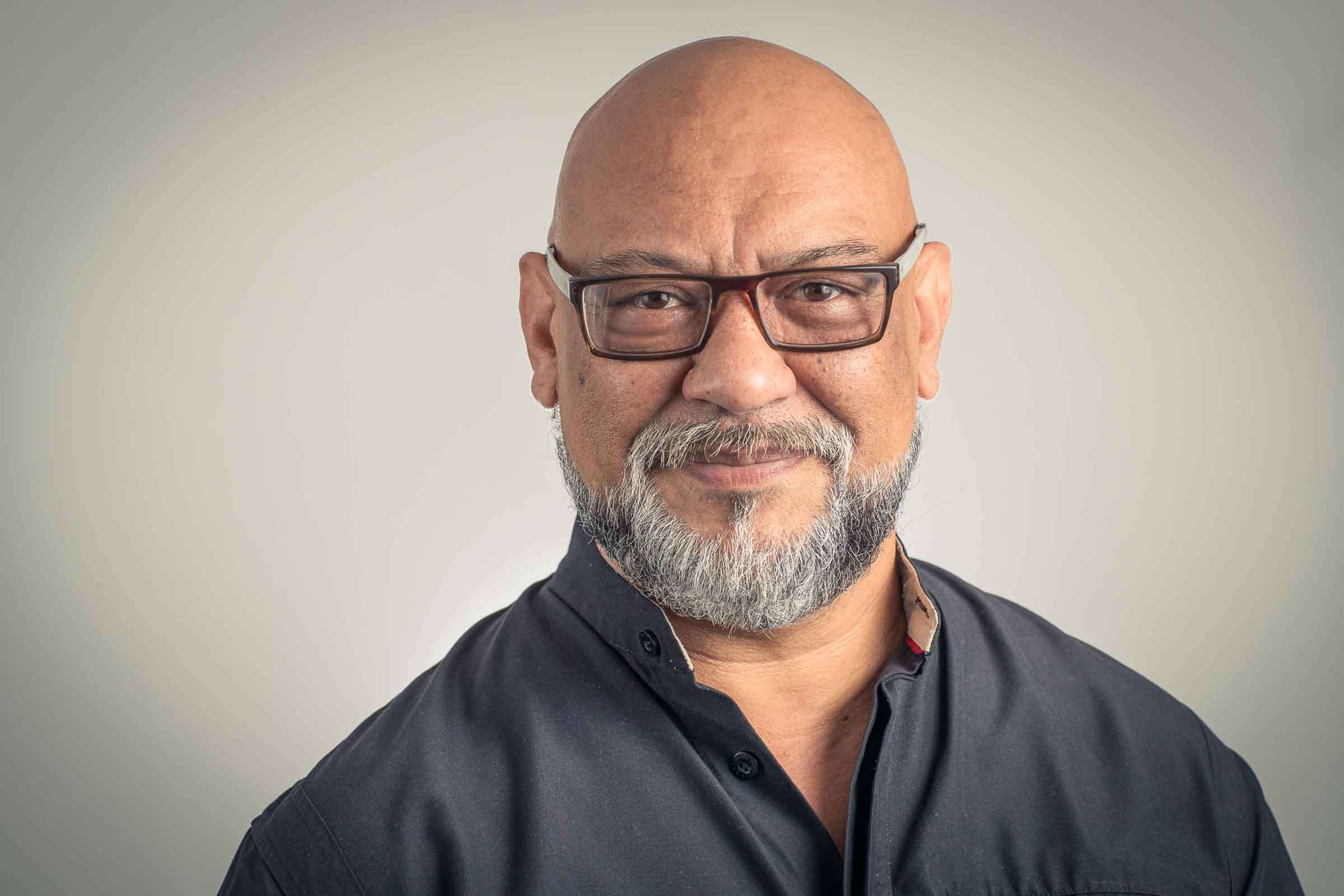 Professional headshot Sydney, man with glasses and grey beard