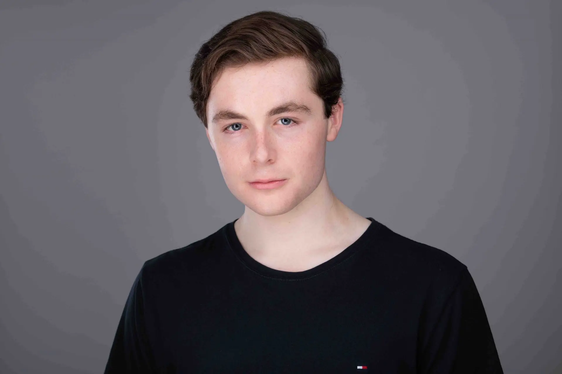 Actor headshot Sydney, young man in black t-shirt