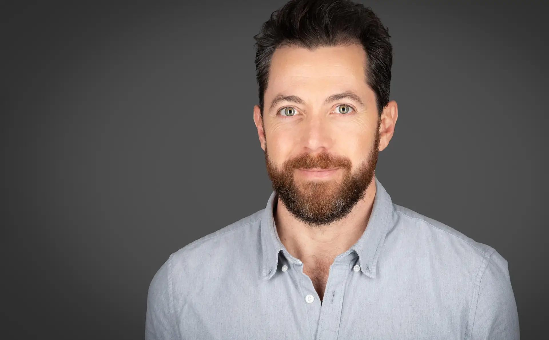 Headshot photography Sydney, man with beard in light blue shirt