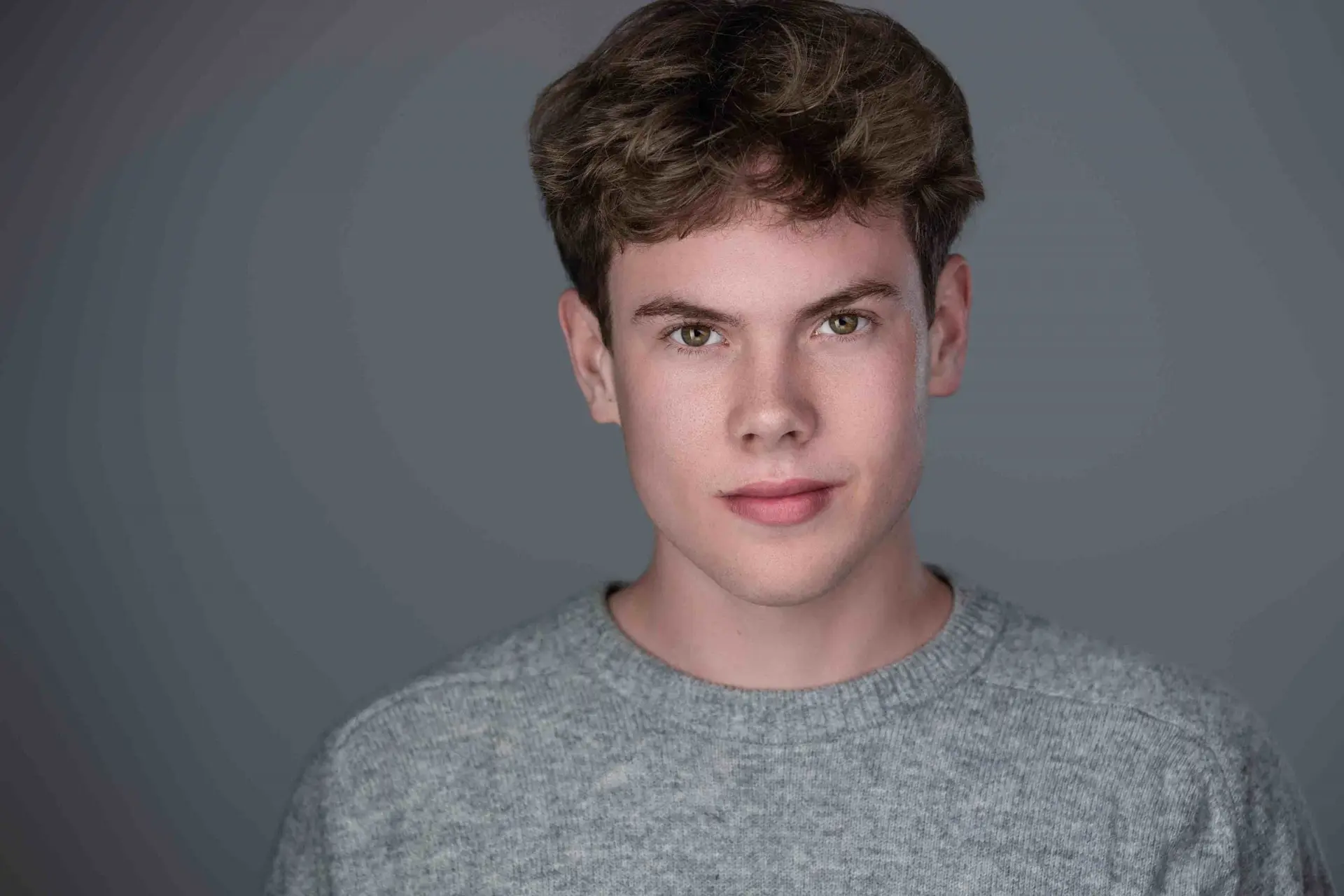 Acting headshot Sydney, young man in grey jumper