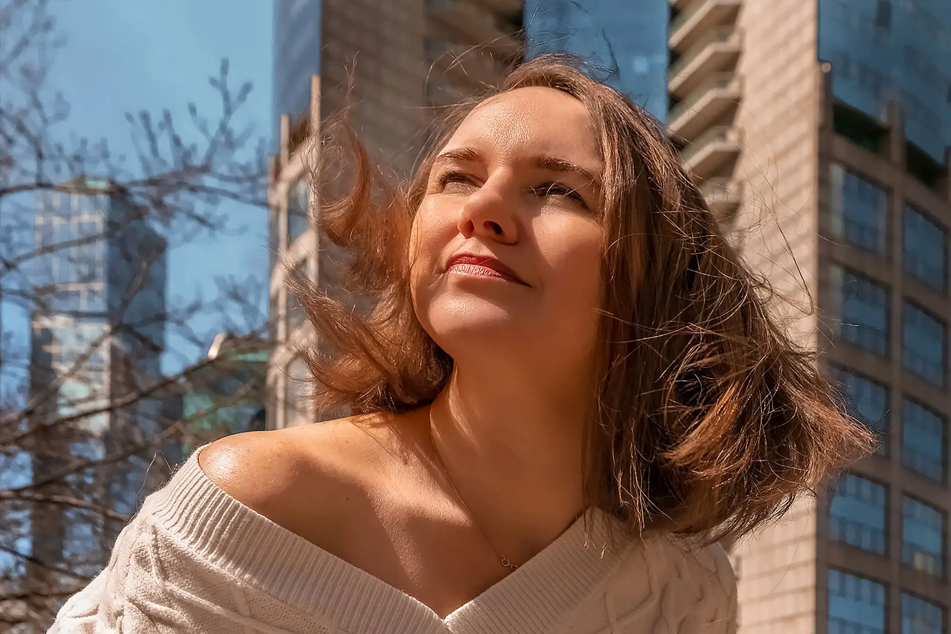 Portrait of a young woman with flying hair. Bottom view
